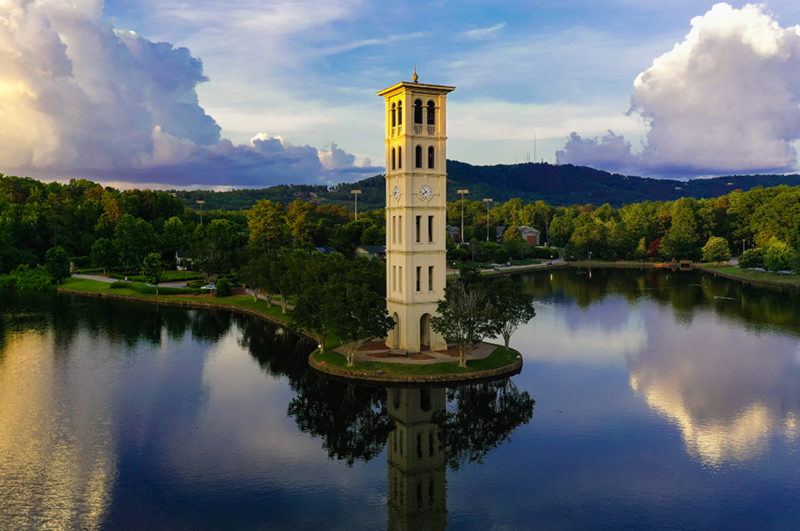 Furman bell tower framed by the blue ridge mountains and evening clouds