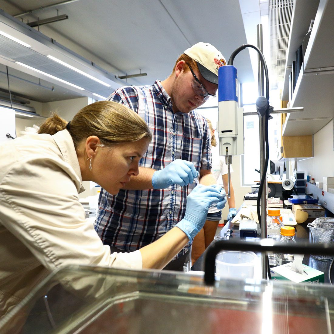 Student and professor conducting research in lab