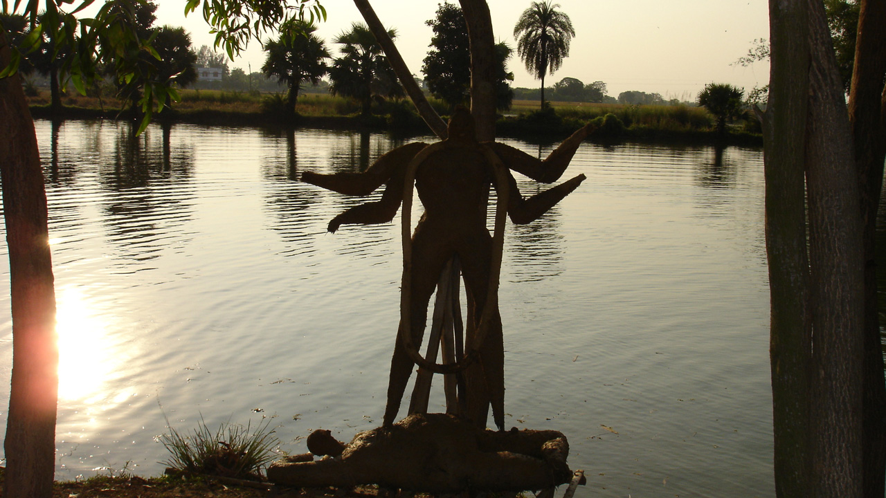 statue figure on lakeside