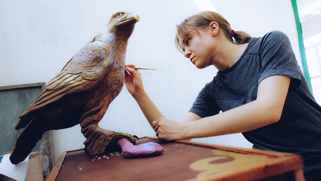 Student added color to a statue of a hawk