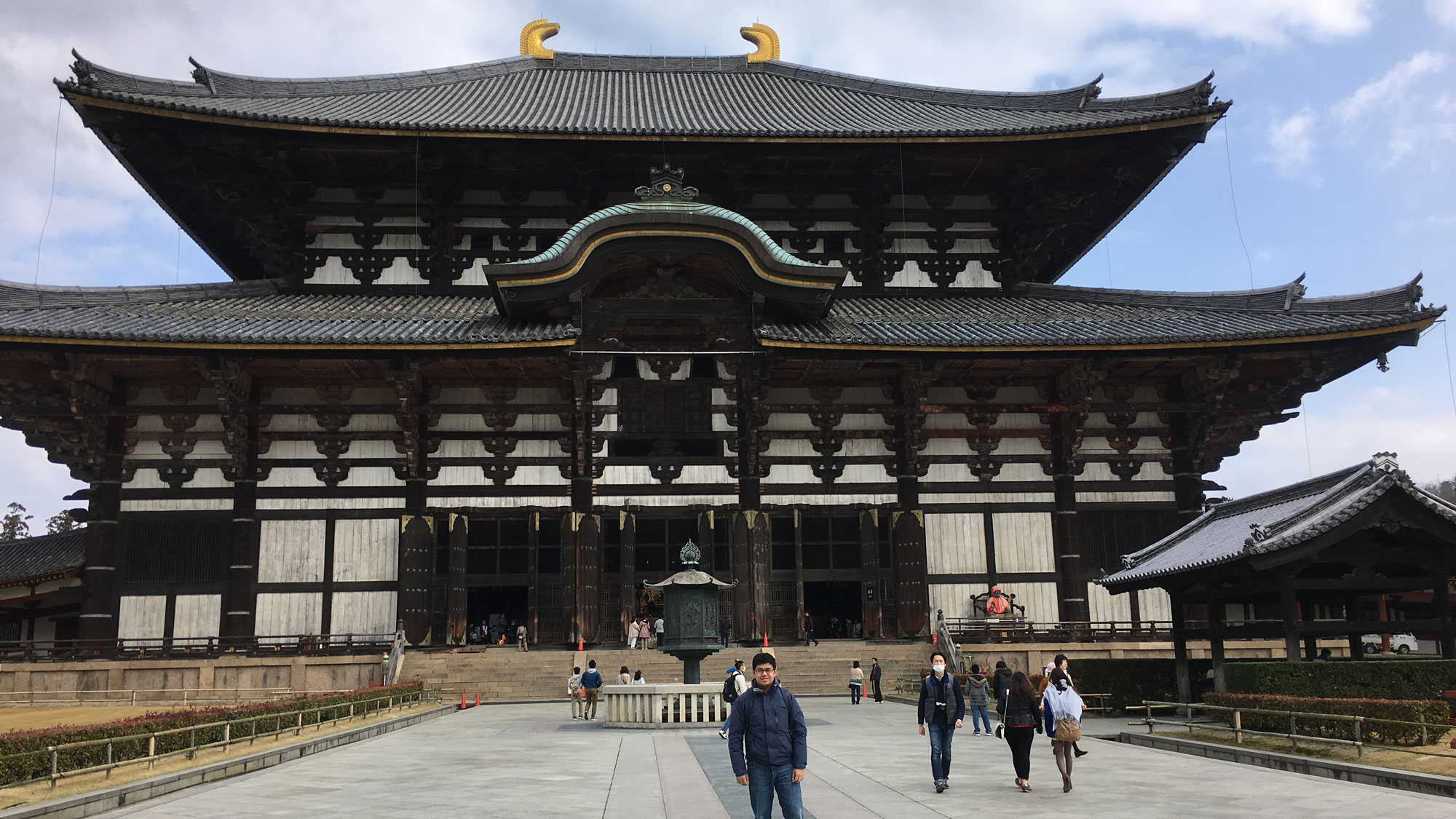 Student pictured in front ofJapanese temple