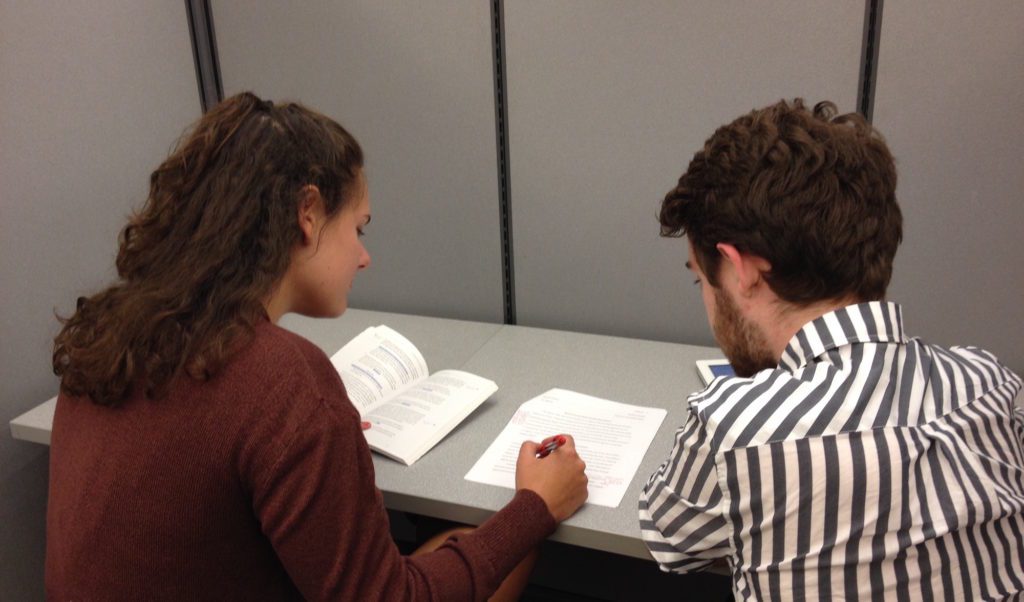 Two students work together on a paper in the Writing and Media Lab.