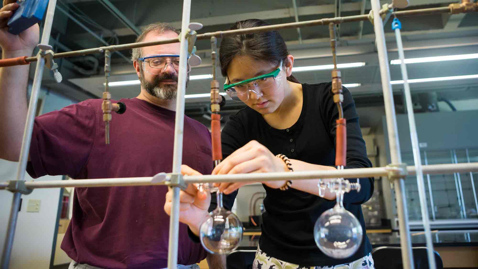 Student working with a professor in the lab