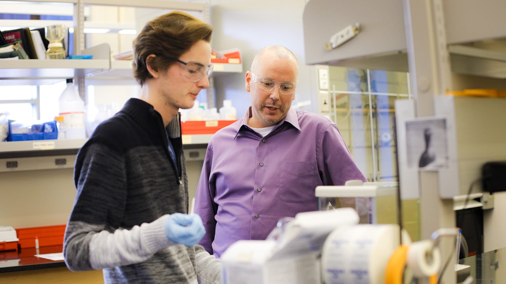 Student speaking to professor about research