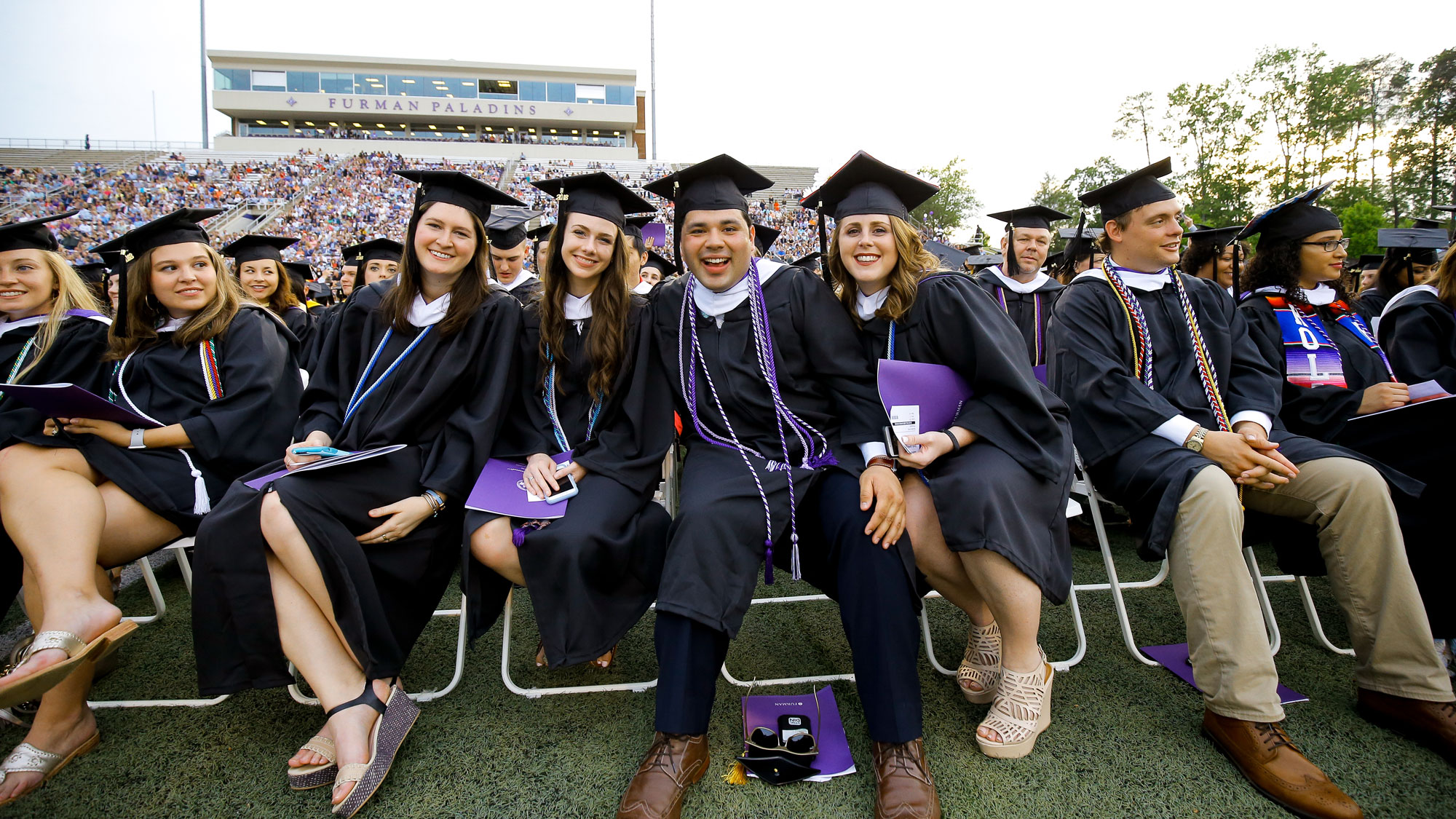 Students sitting at graduation