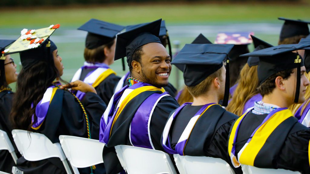 Student turning and smiling at the camera