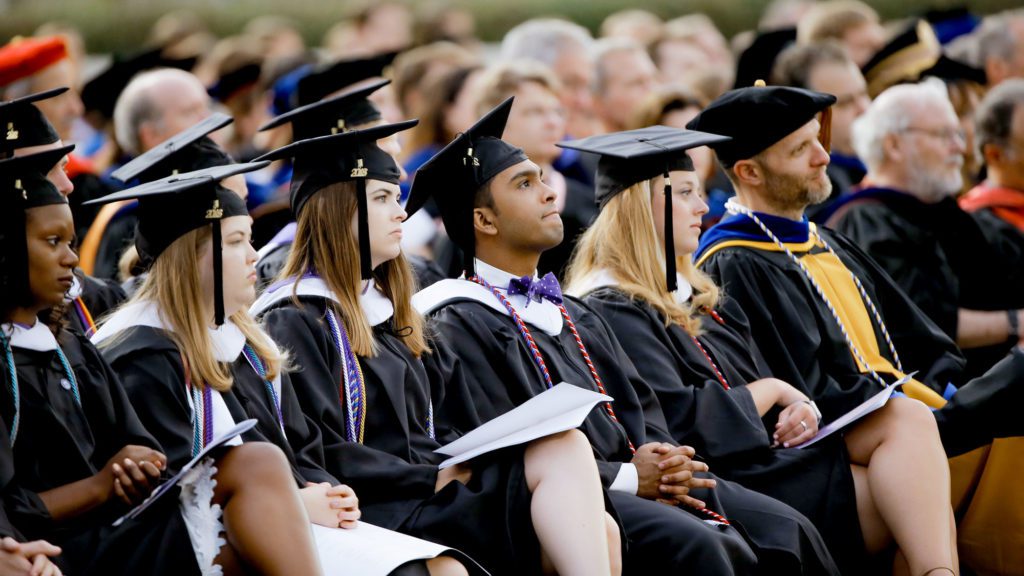 Student sitting at commencement