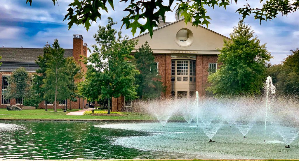 Riley Hall from afar, fountains in foreground
