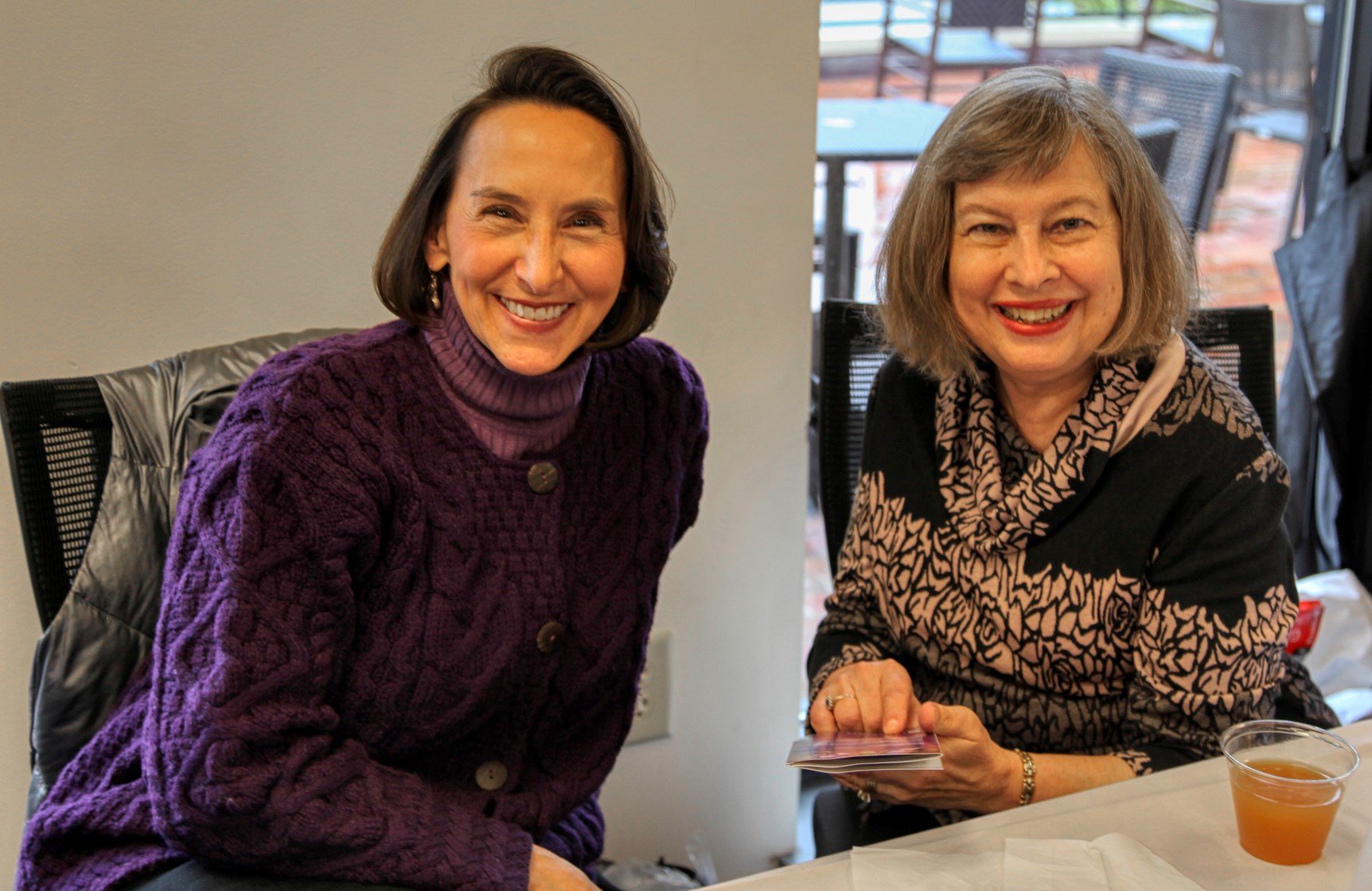 English professors smiling during an event