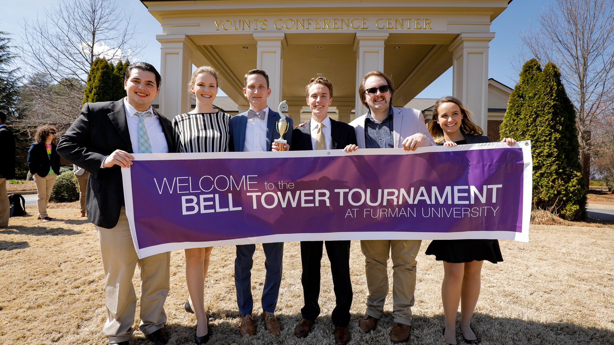 Bell Tower Tournament group photo, students are holding a banner