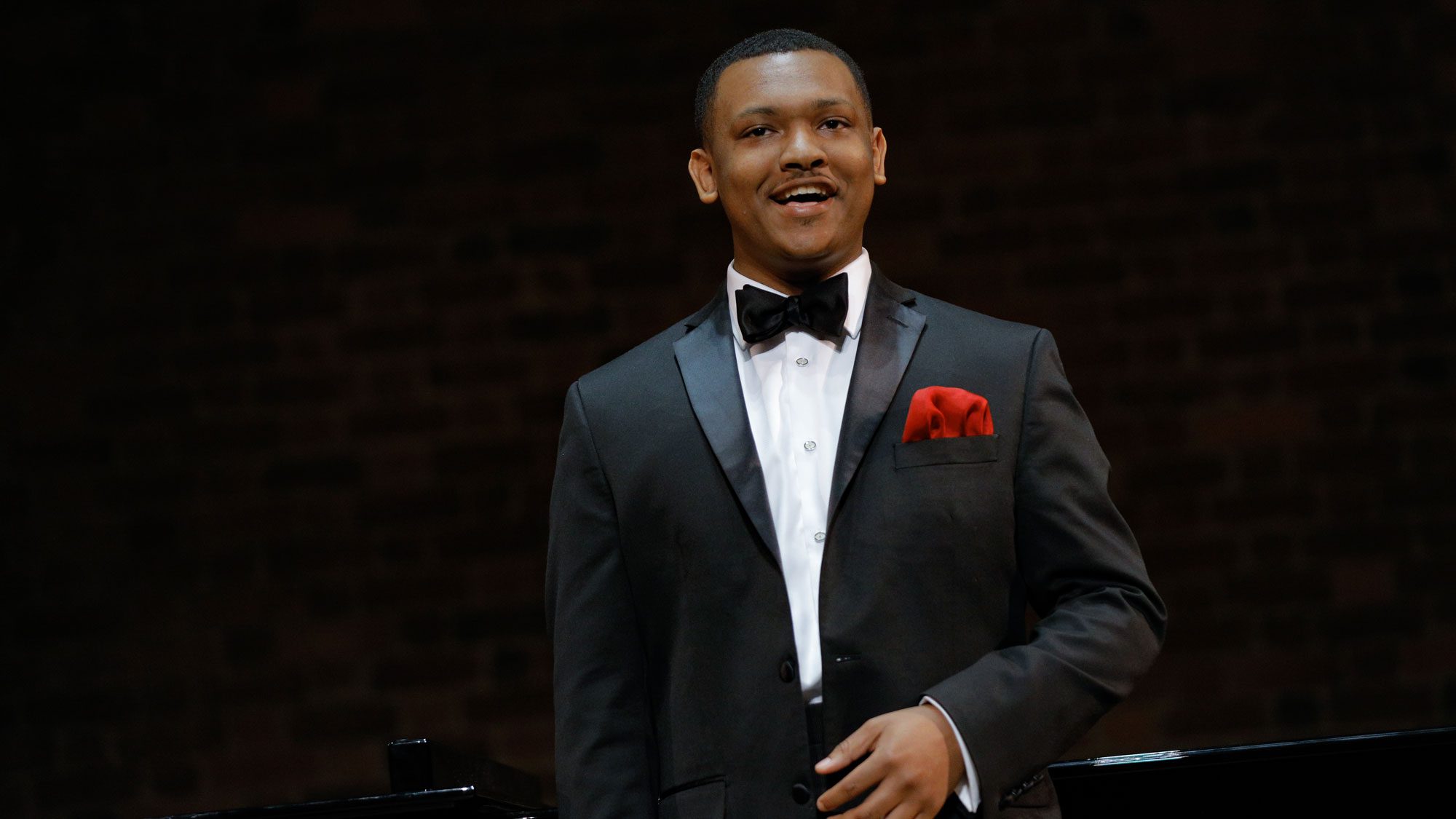 Student singing in the recital hall