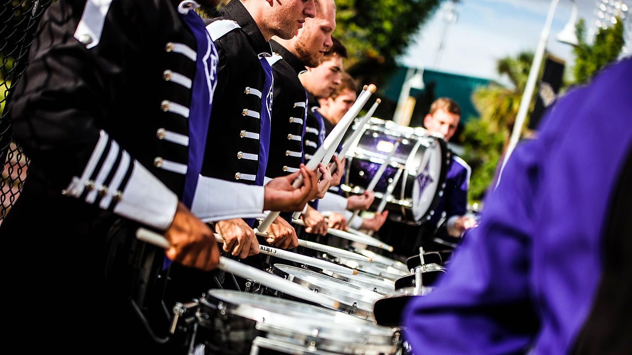 Students playing the drums in marching band