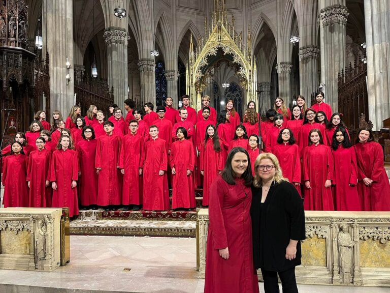 New York Children's Choir in their bright red robes on the chancel of New York's St. Patrick's Cathedral