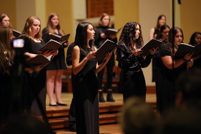 Close up photo of members of Belle Voci (Beautiful Voices) performing during the Fall 2022 Choir Concert.