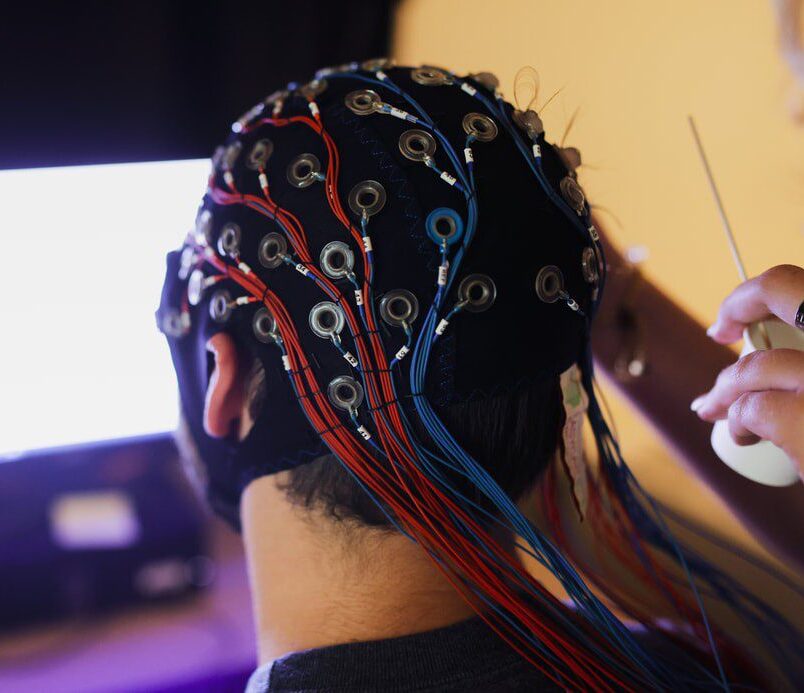 student in EEG cap