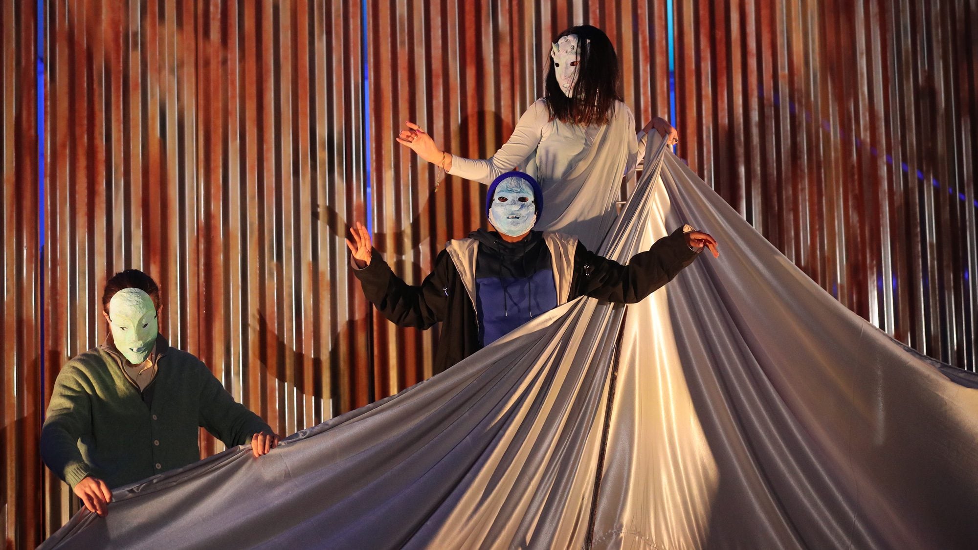 students performing in masks