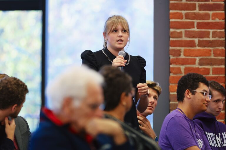 A college students asks a question about political discourse in American elections