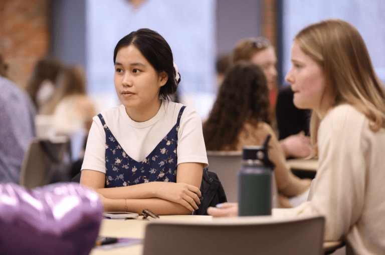 Students engage in table discussions at the Tocqueville Center 