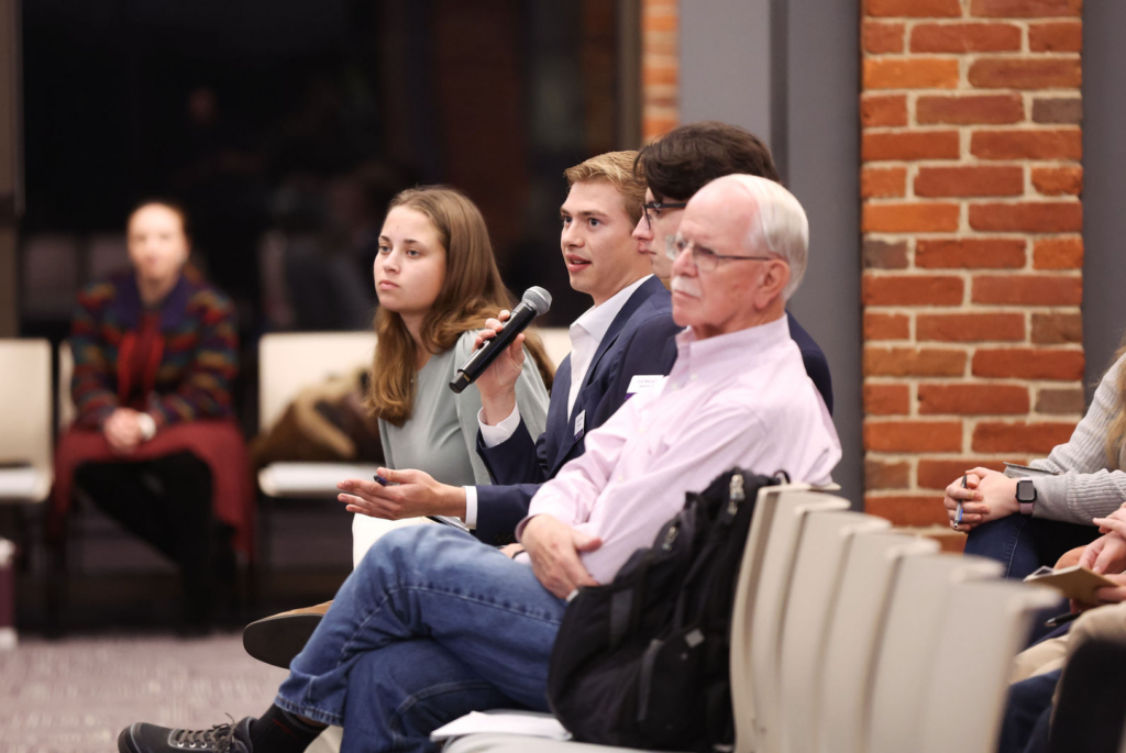 Tocqueville Fellow Zach Lacombe asks a question during a Tocqueville Center event featuring political scientists Gary Marks and Liesbet Hooghe at Furman University.