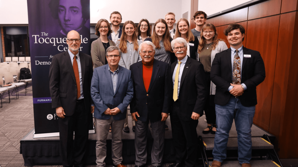 Nathan Johnson and fellow Tocqueville Fellows pose with faculty and guest speakers following a discussion on religion, the military, and American foreign policy hosted by the Tocqueville Center at Furman University.
