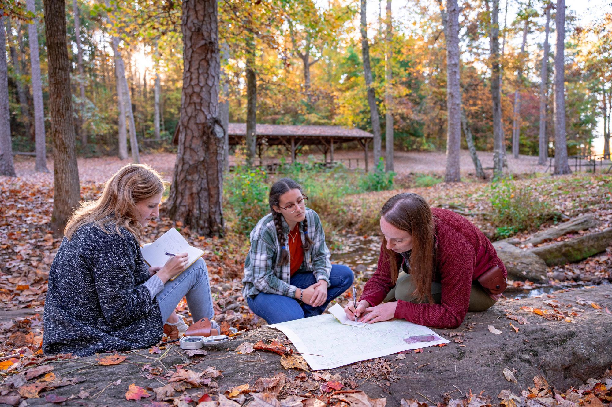 Students outside journaling