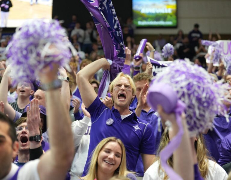 Tate cheers on the Paladins during the men’s basketball game against Wofford in the SoCon tournament final in Asheville on Monday, March 10, 2025.