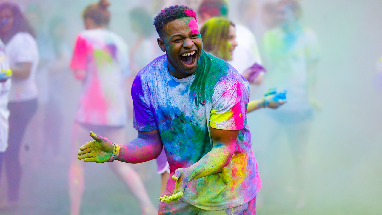 Holi celebration, student covered in paint
