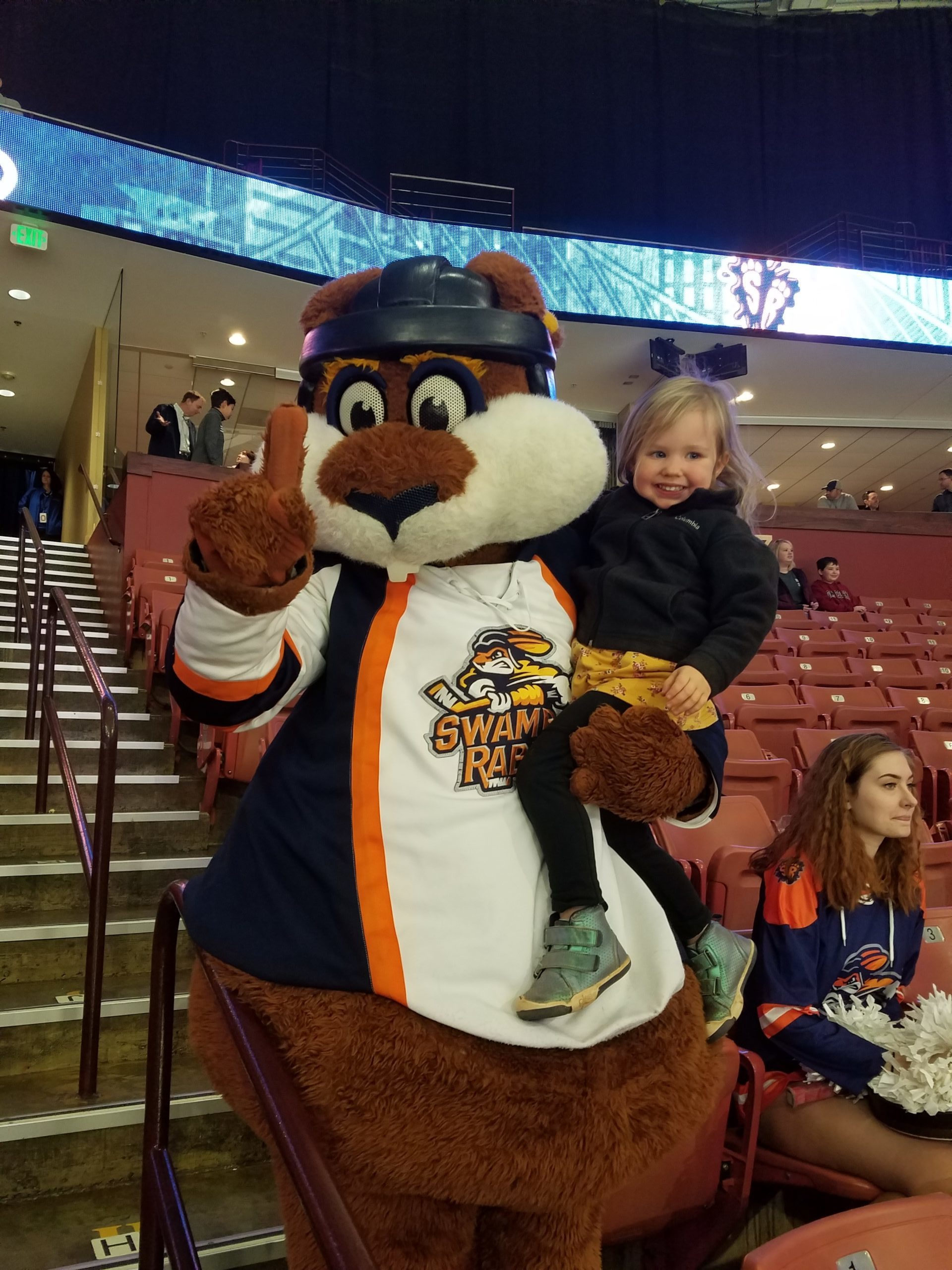 Young girl posing with Swamp Rabbit mascot