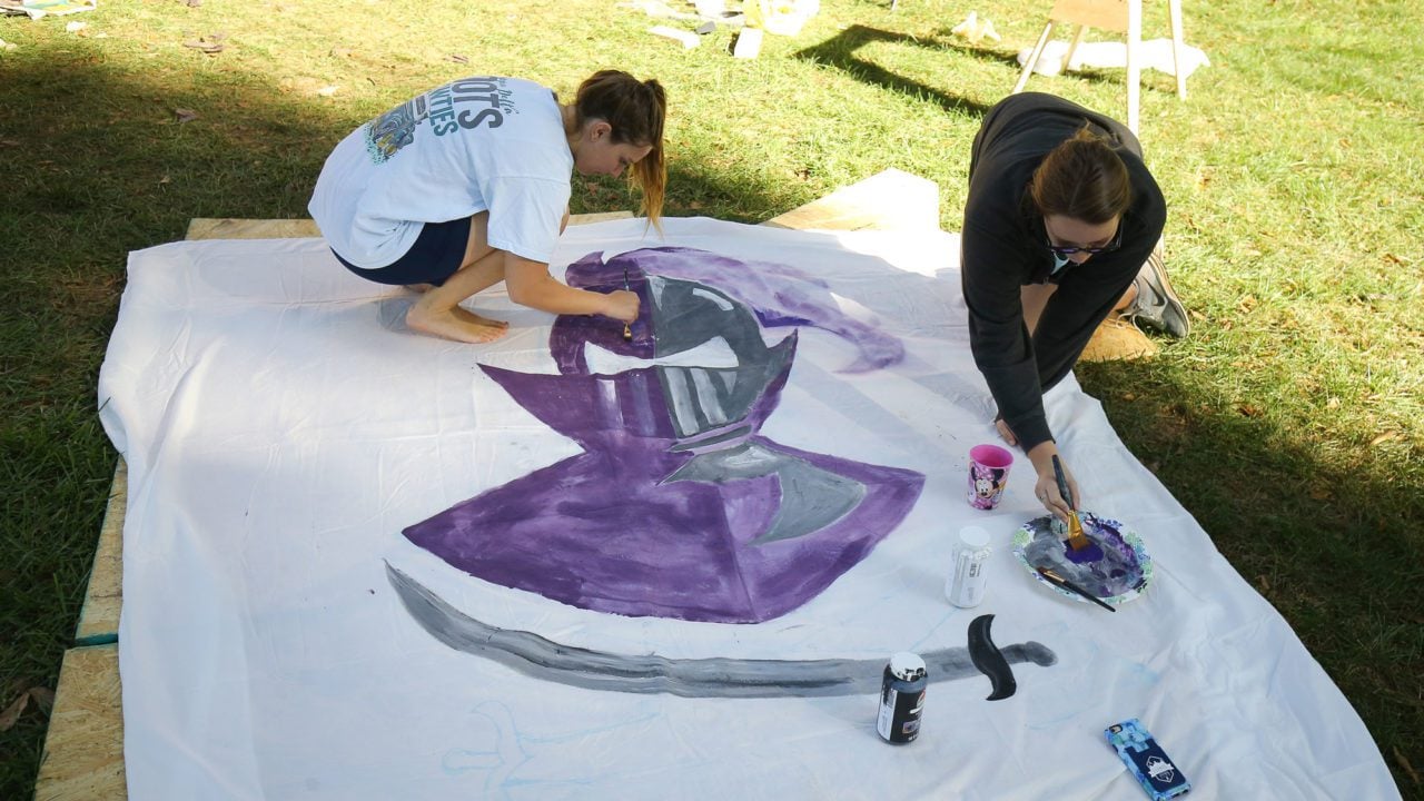 Students painting a paladin flag