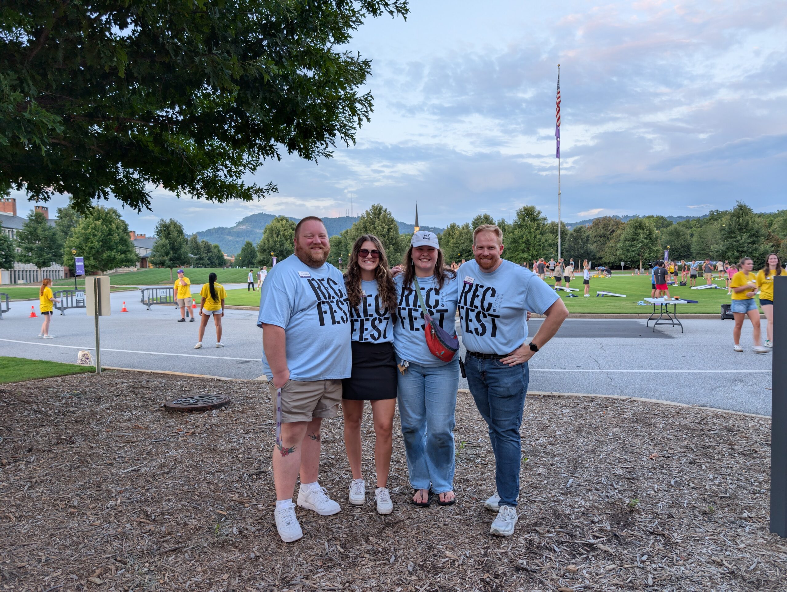 The CRW professional staff are pictured in front of the flag pole circle.