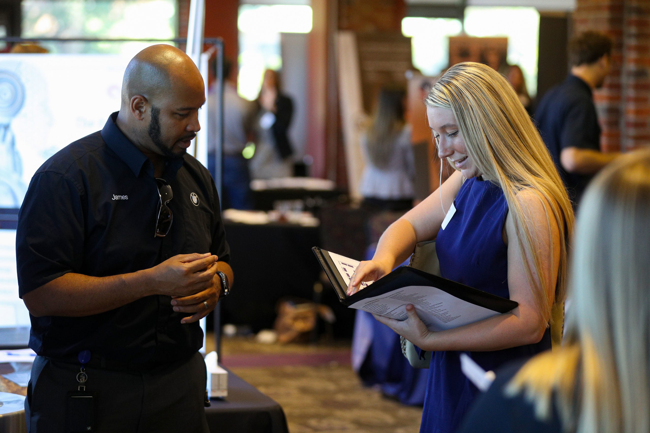 Student sharing career book with advisor