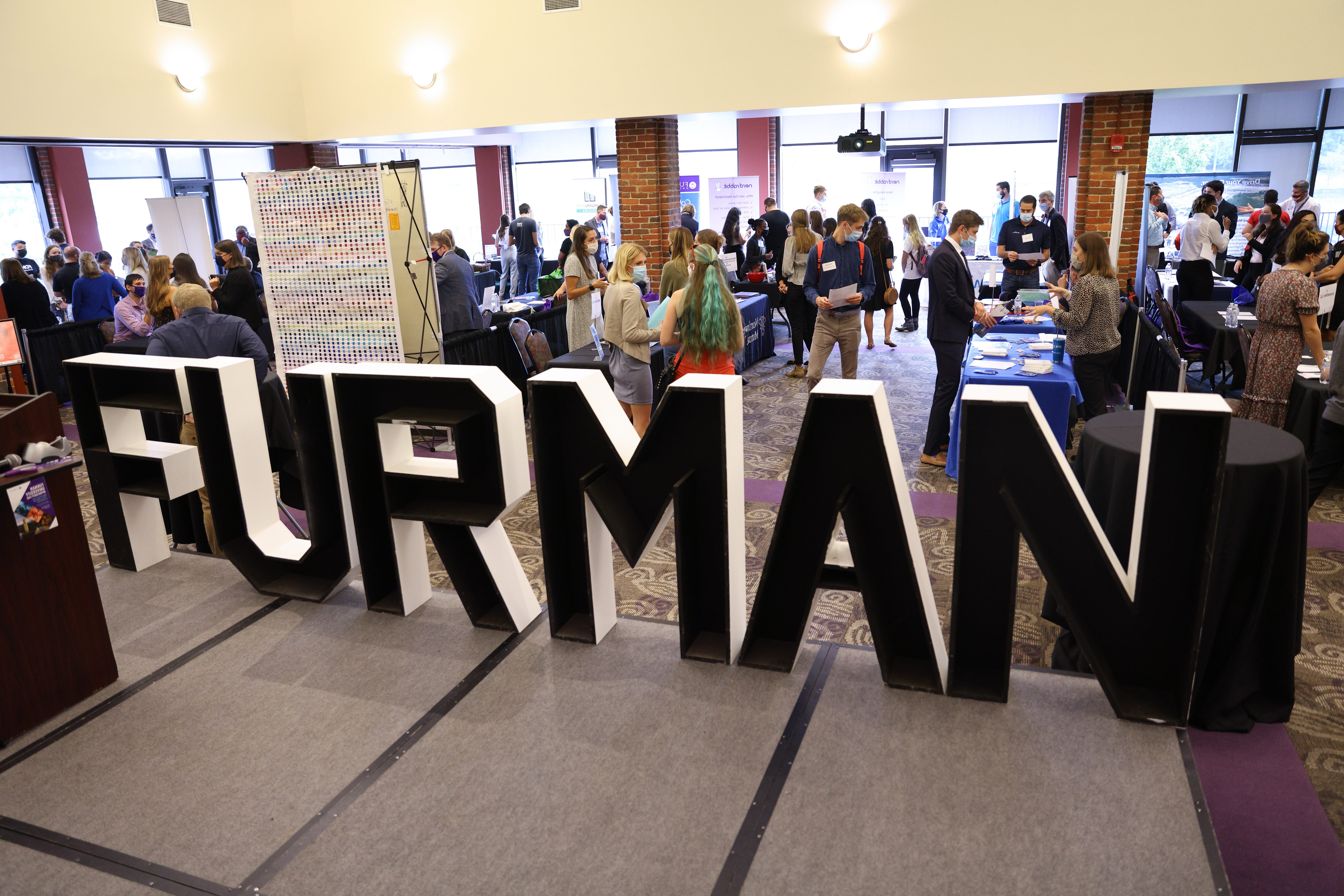 Students meeting employers on Furmans campus career fair
