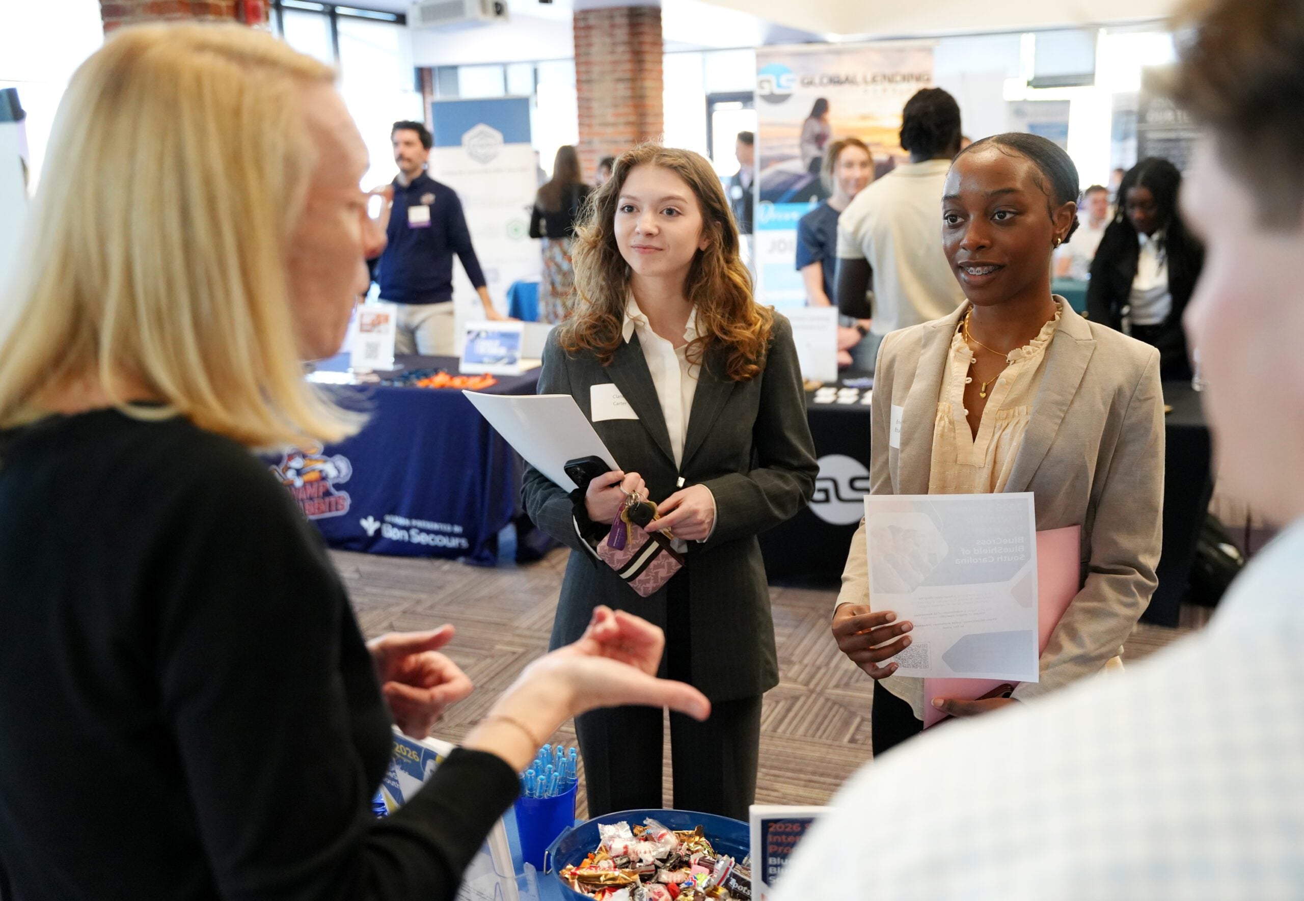Students speak with an employer representative at the Career and Internship fair.