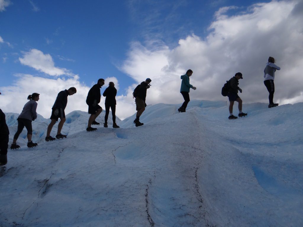 Students walking up ice caps in Argentina