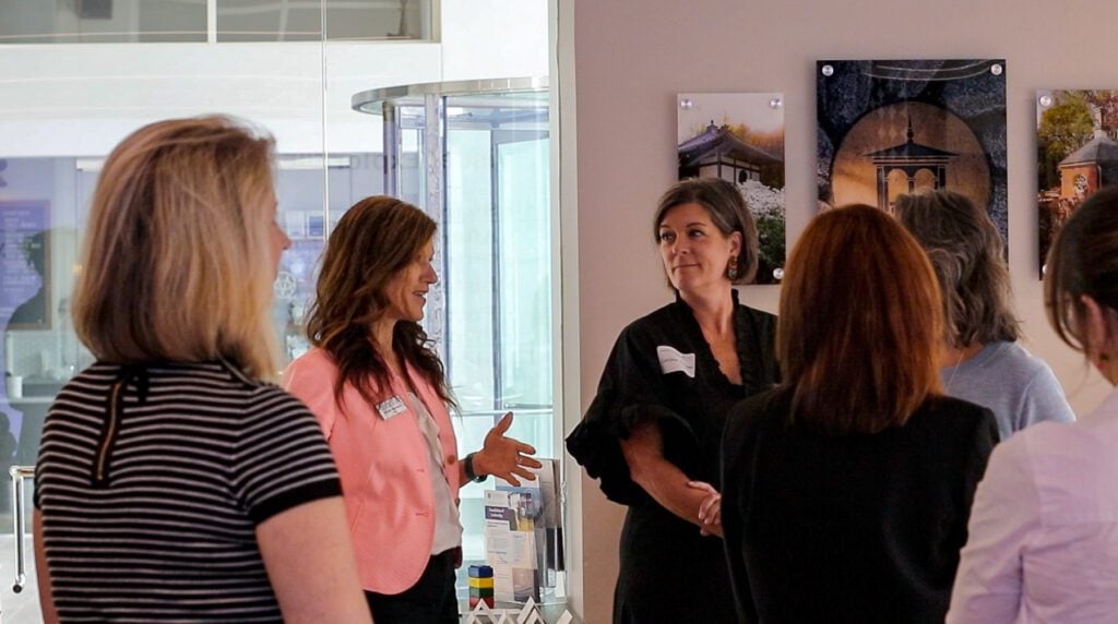 a group of women discussing something