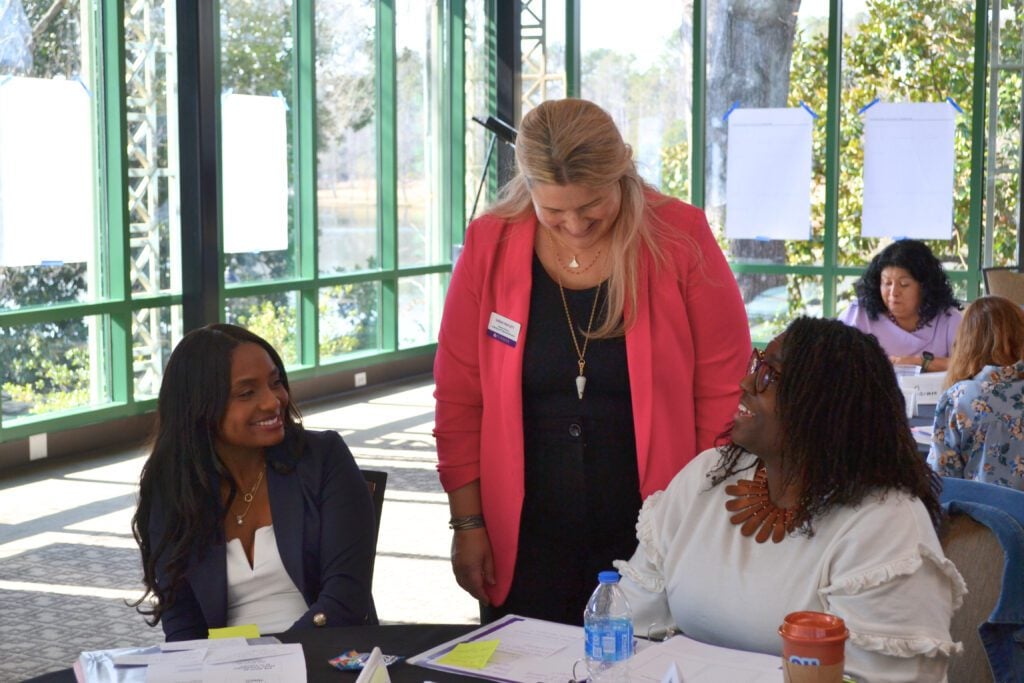Sarah Waylett, Director of Product Design at the Center for Innovative Leadership, speaks with two members of the fall 2024 cohort