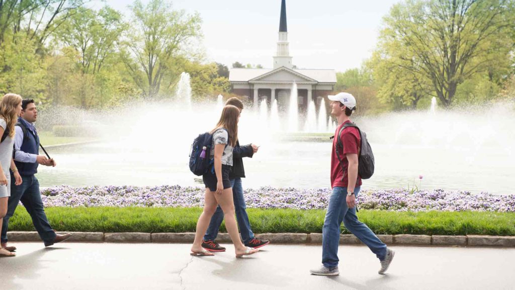 Students walking to class in front of chapel