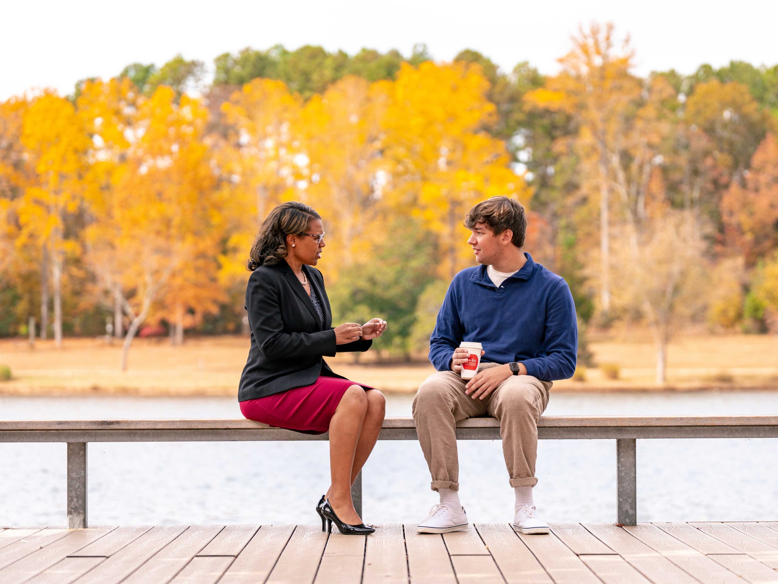 Shaniece Criss with student TJ Robertson at Timmons Pavilion and walking up that walkway during Fall. Shot during the Heavy shoot