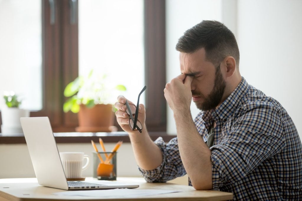 Student holding head in frustration