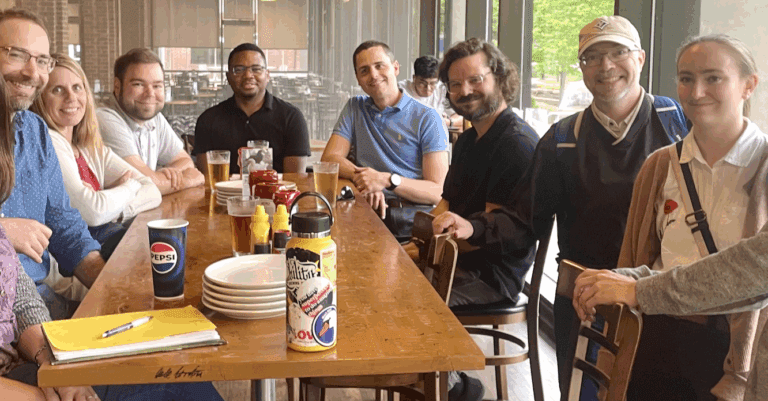 An image of co-workers enjoying libations together.