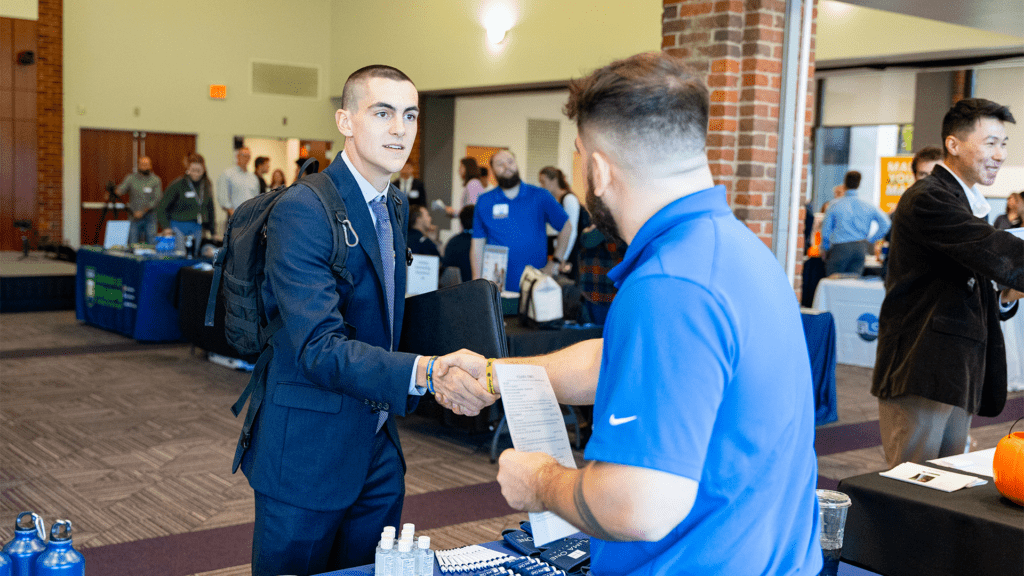 Student shaking hands at career event