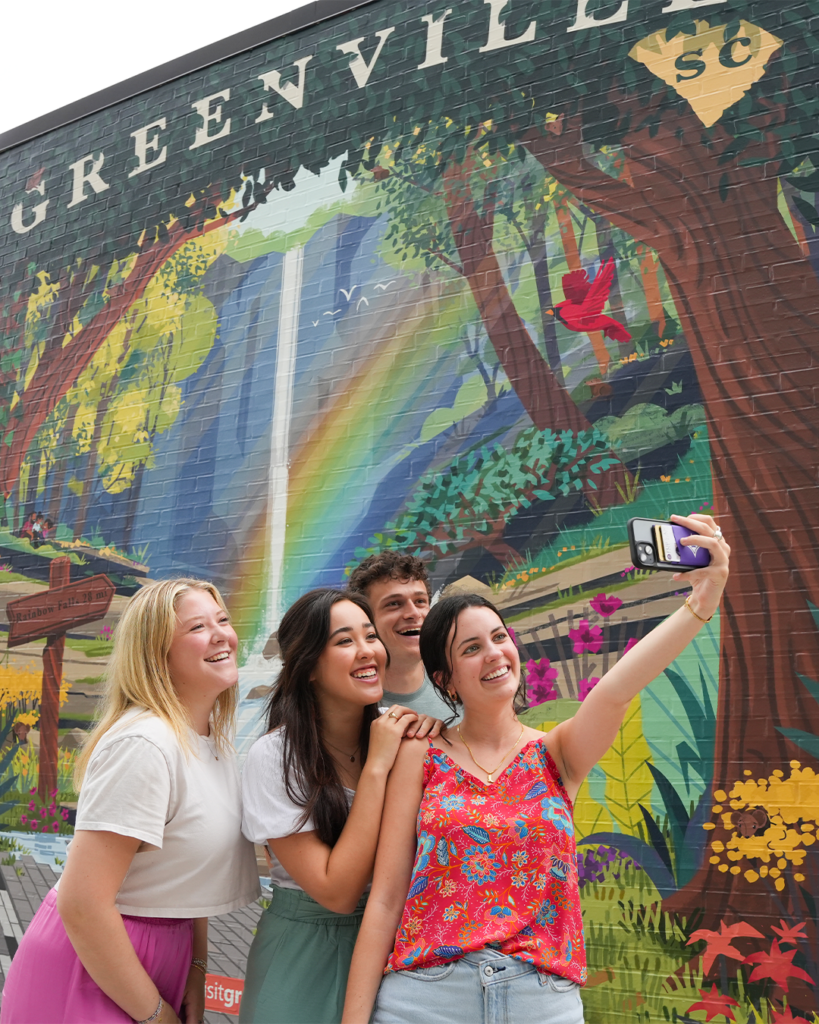 Group of students taking a selfie in downtown GVL