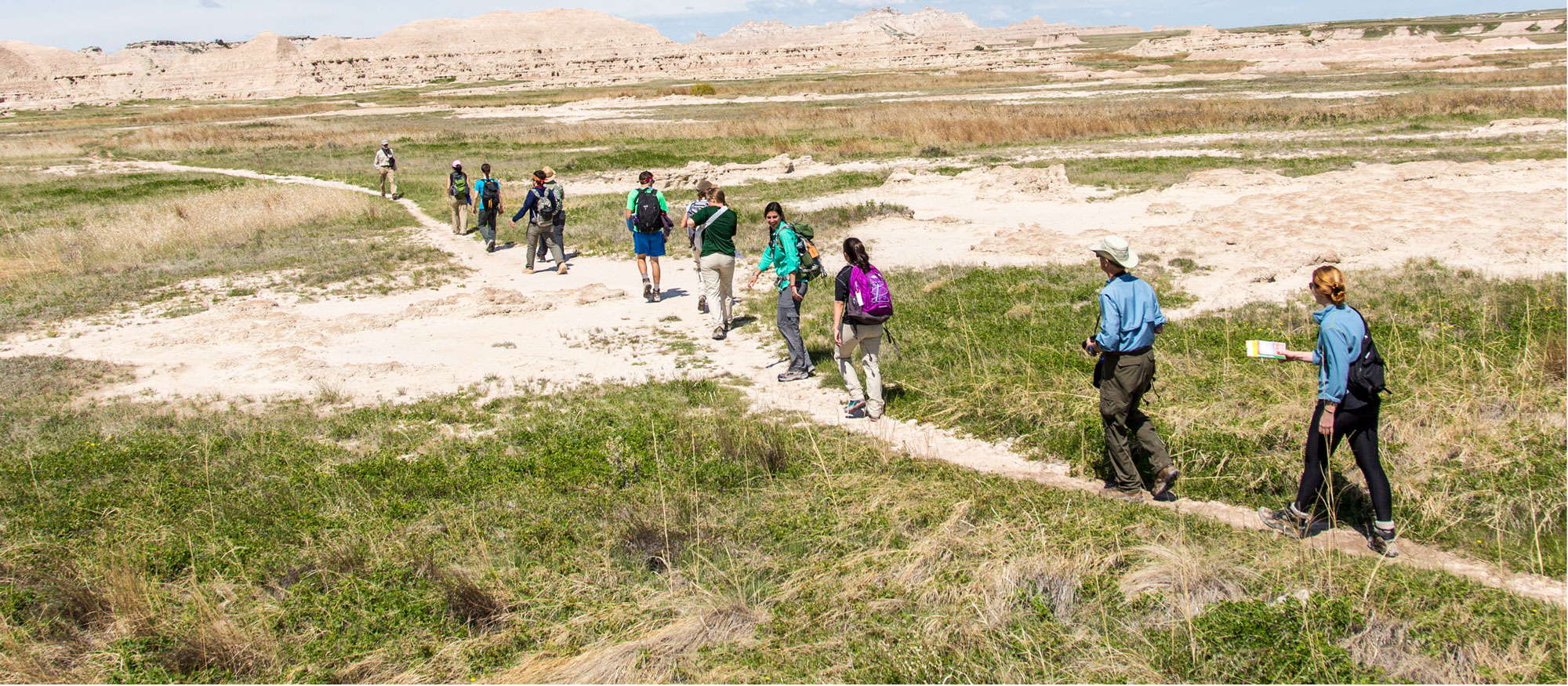 Students walking through the desert during a May X