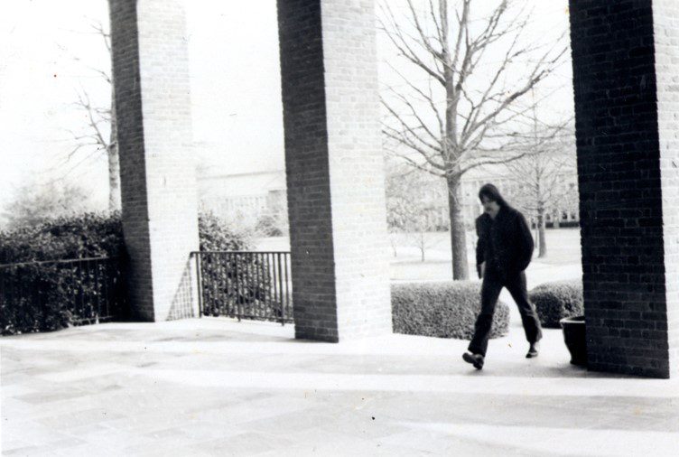 Black and white image of Thomas Rain Crowe walking