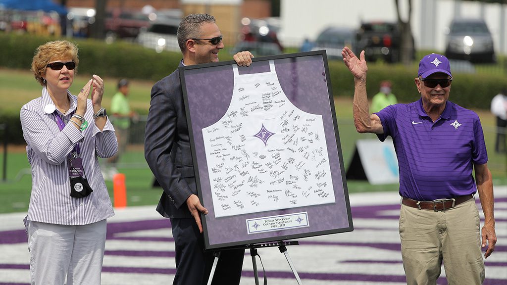 Tommy Stevenson '65 being presented a Furman apron