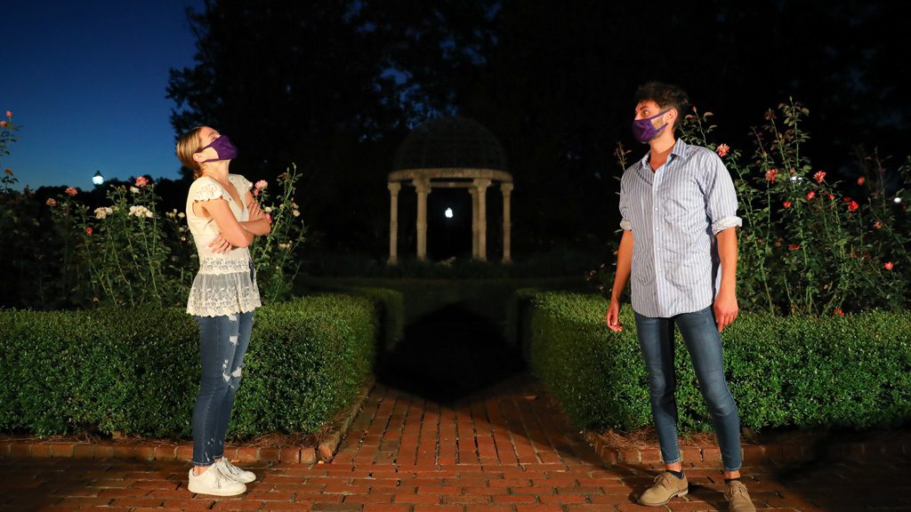 Students performing theatre in the rose garden