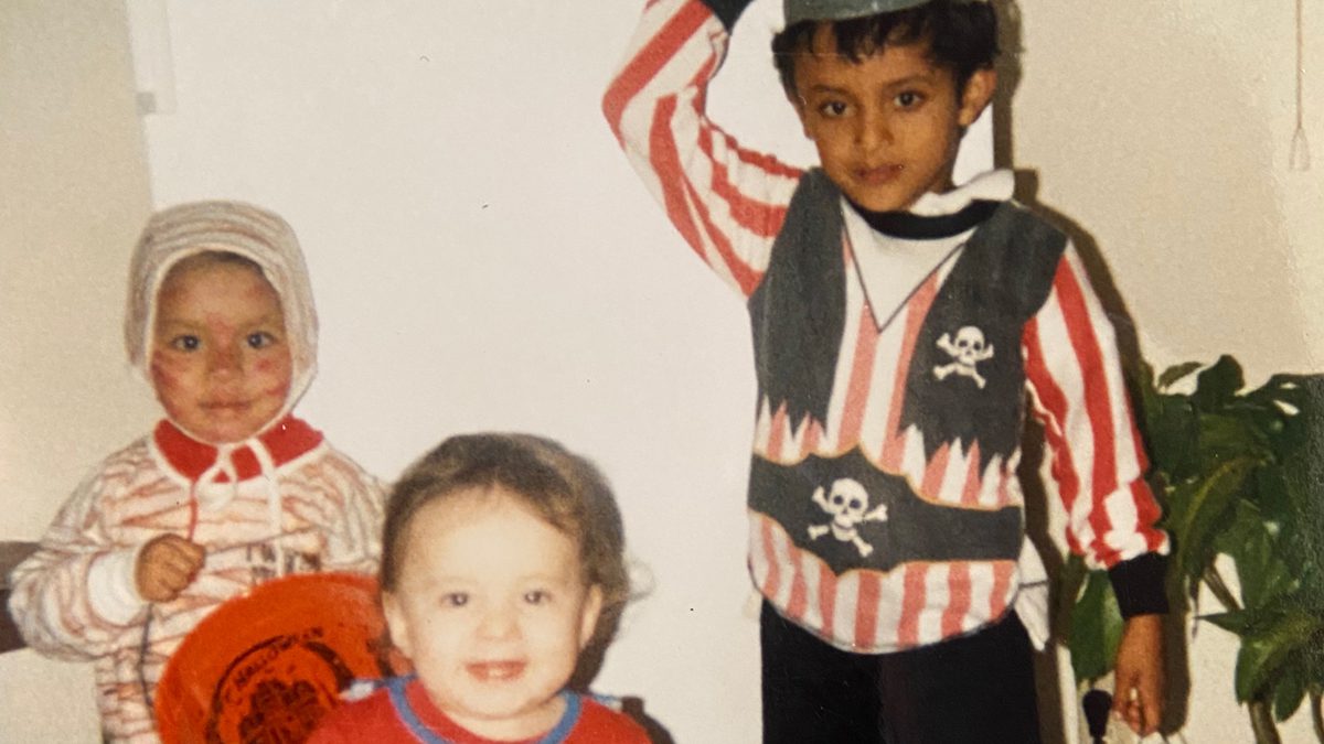 Saul Antonio Rivera ’13 (far right) on Halloween at Fort Rucker in Alabama, in 1990, with his brother Darwin (far left) and sister, Cindy