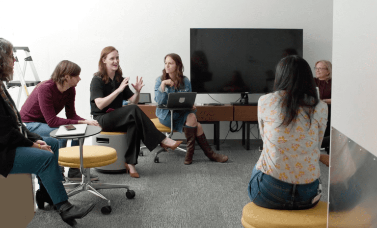 MASD graduate discusses project with marketing team