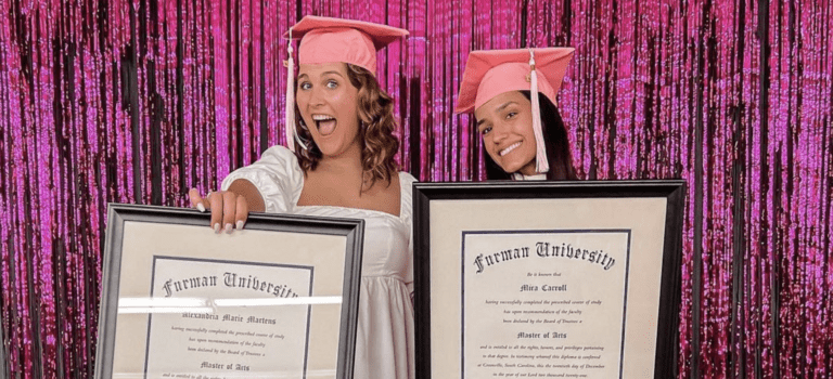 Alex Martens and Mira Carroll celebrating graduation