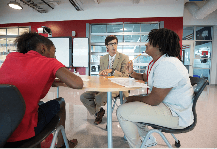 teacher talking to students